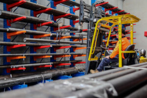 Warehouse working operating forklift in VH Steels warehouse